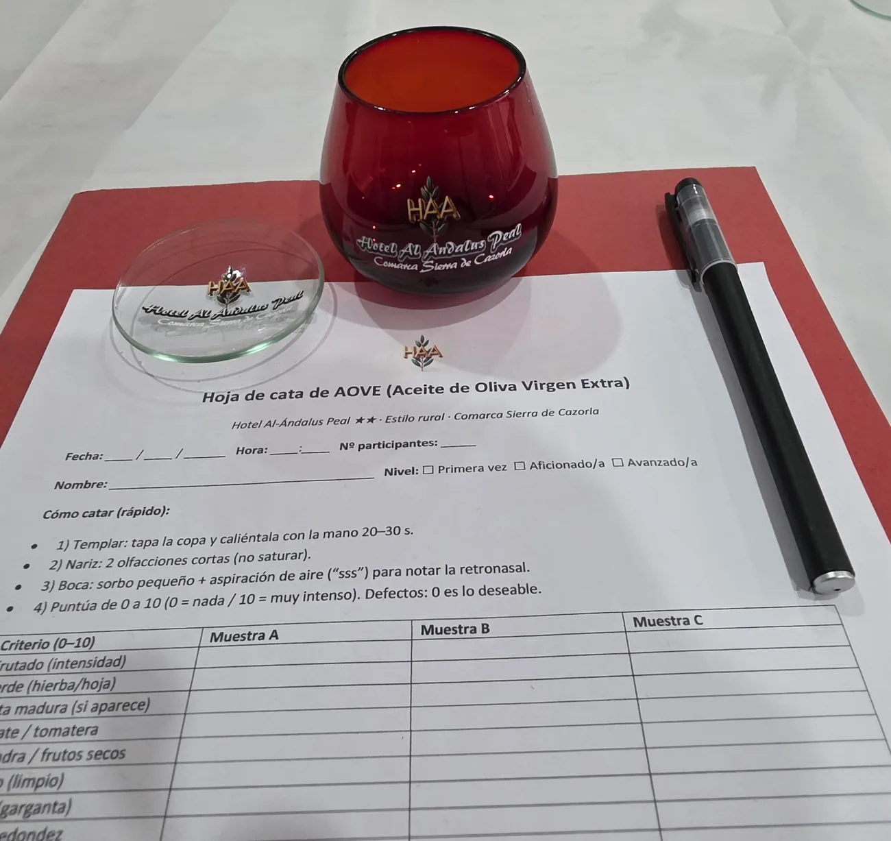 Personalised EVOO tasting sheet with red glass and pen